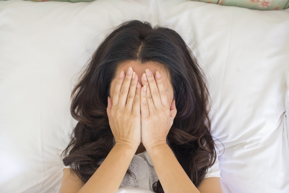 woman depressed, bad feelings, lying on bed