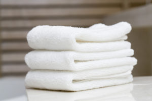 stack of white towels to keep in the car