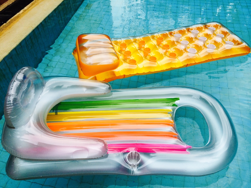 floaties inflatables laying in pool at home