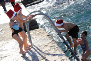 children diving at the thomas smith charity swim, christmas swim